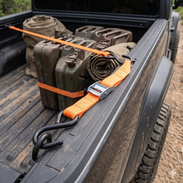 Orange Tie Down Strap Securing Cargo on Truck Bed